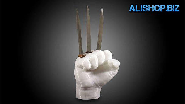 A set of steak knives with stand in the form of a fist Steak Knife Holder