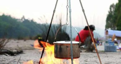 Camping tripod with hooks for cooking on the fire
