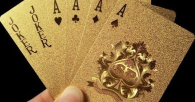 A set of playing cards in a gold design