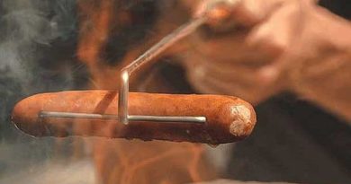 A skewer for roasting sausages over a fire Crank-Eez